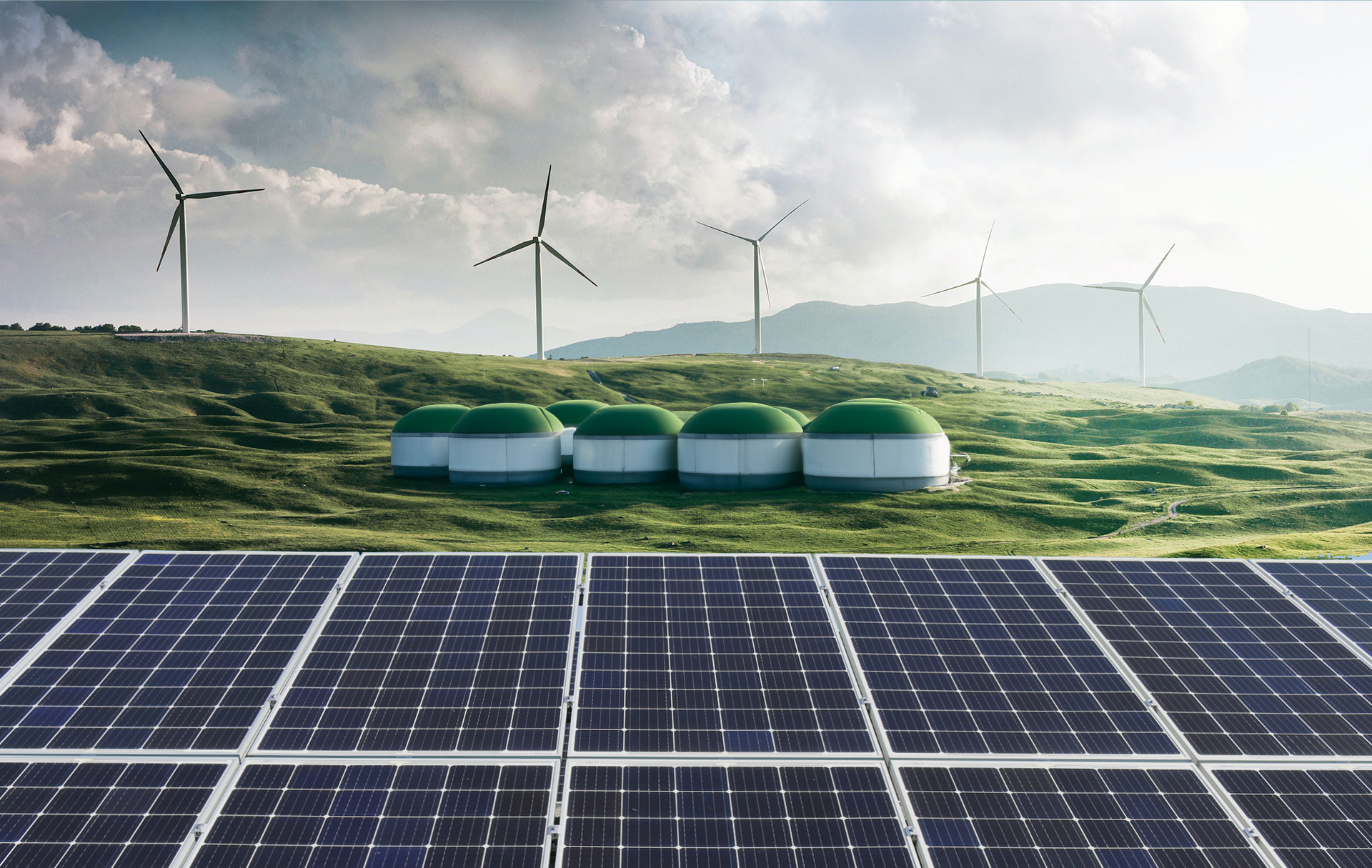 Windräder, eine Biogasanlage und Solarpanels